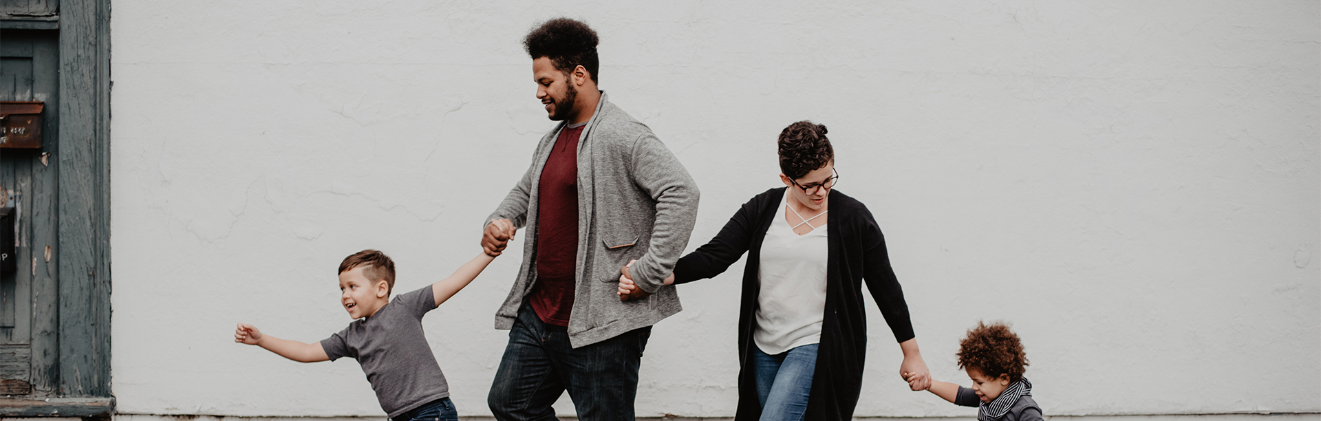 1family-of-four-walking-at-the-street-2253879